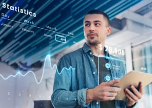 A professional using AI-powered financial analytics, with a futuristic data visualization interface displaying real-time KPIs, income tracking, and expense management. This represents how generative AI enhances business intelligence by automating data insights, detecting anomalies, and optimizing financial decision-making.